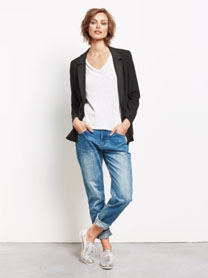 With boyfriend or girlfriend jeans and a suit jacket